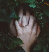 oval diamond ring on finger