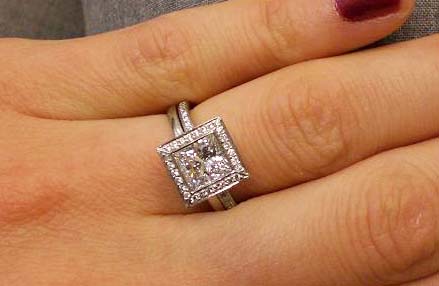 Princes cut diamond set in bezel setting with sharp cornered halo