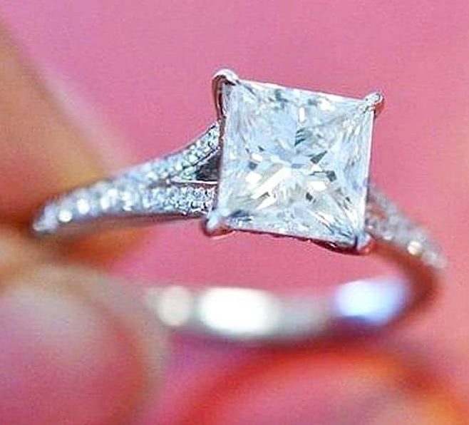 Princess cut diamond with micro pave diamonds in the band that splits