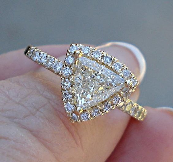 trillion cut set with a diamond halo