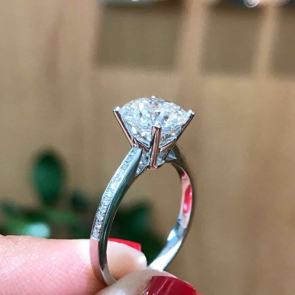 Diamond Solitaire Ring with diamonds set in the band