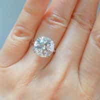 5 carat diamond ring on finger