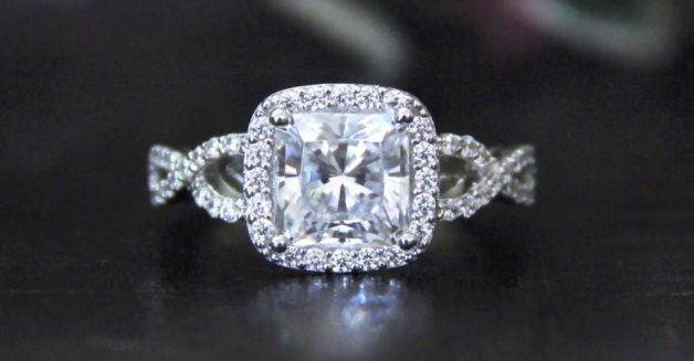 Cushion Cut Diamond in cross over art deco styled ring setting